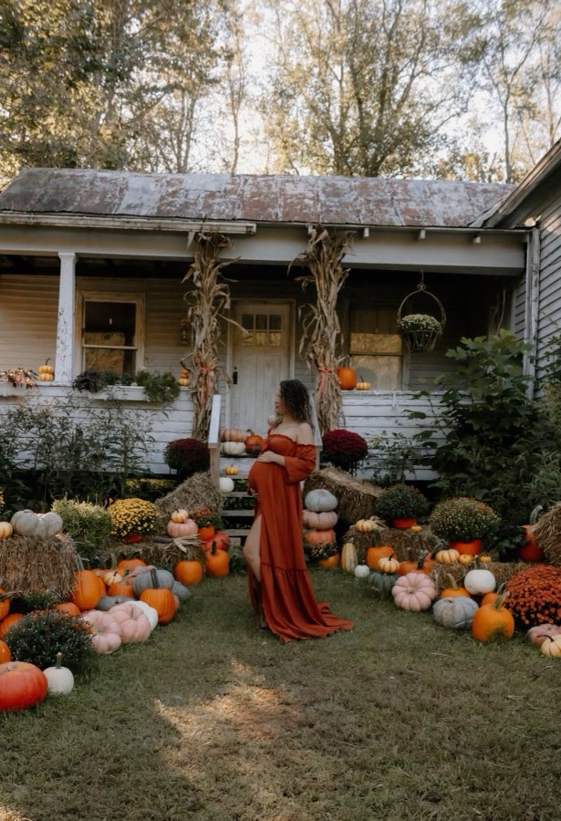 Maternity session among autumn flowers near Grayson.
