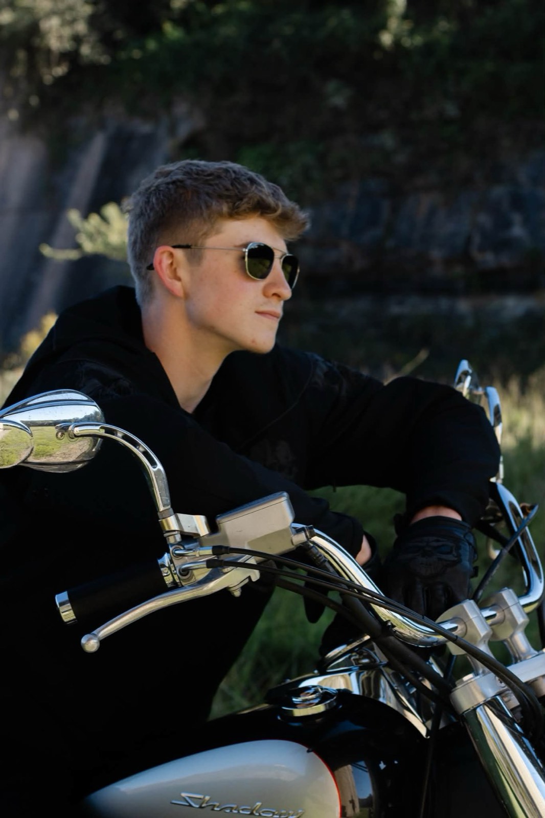 East Carter senior Matthew with his motorcycle, photographed by Omens Photography.